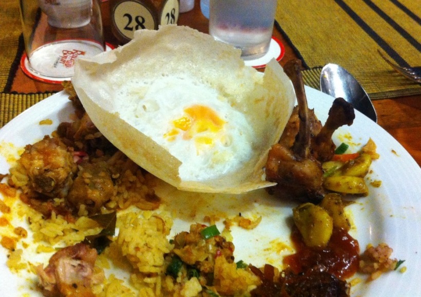 Egg hopper along with grilled chicken, yellow rice, curry, chutney and other goodies (dinner at Raja Bojun)